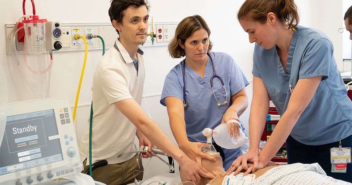Medical professionals assisting one another