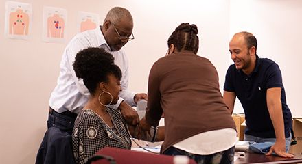 People learning how to take blood pressure